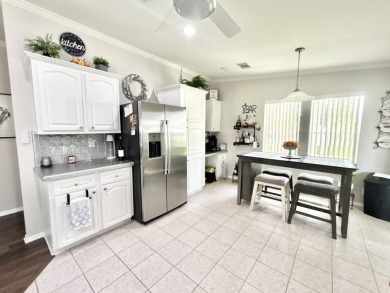 Welcome to this beautifully maintained 3-bedroom, 2-bathroom on Crane Lakes Golf and Country Club in Florida - for sale on GolfHomes.com, golf home, golf lot