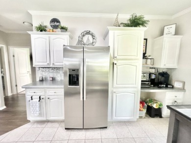 Welcome to this beautifully maintained 3-bedroom, 2-bathroom on Crane Lakes Golf and Country Club in Florida - for sale on GolfHomes.com, golf home, golf lot