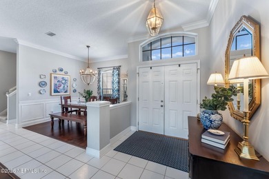 Tucked along a tranquil lagoon inside the prestigious on Jacksonville Golf and Country Club in Florida - for sale on GolfHomes.com, golf home, golf lot