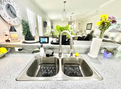 Welcome to this beautifully maintained 3-bedroom, 2-bathroom on Crane Lakes Golf and Country Club in Florida - for sale on GolfHomes.com, golf home, golf lot