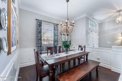 Tucked along a tranquil lagoon inside the prestigious on Jacksonville Golf and Country Club in Florida - for sale on GolfHomes.com, golf home, golf lot