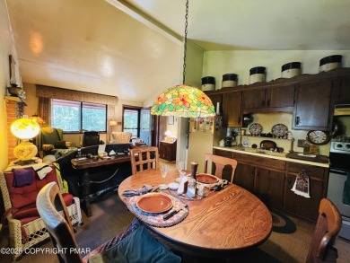 Welcome to this cozy 2-bedroom, 1-bath ranch home nestled in the on Pocono Farms Country Club in Pennsylvania - for sale on GolfHomes.com, golf home, golf lot