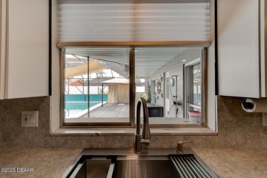 WOW FACTOR is on prominent display throughout this fantastic on Daytona Beach Golf Club in Florida - for sale on GolfHomes.com, golf home, golf lot