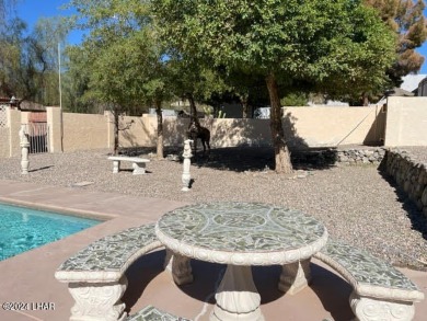 This 3 Bedroom + Den, 2 Bathroom Pool home, is perfectly located on London Bridge Golf Course in Arizona - for sale on GolfHomes.com, golf home, golf lot