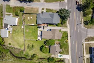 This updated, fully furnished 3-bedroom, 2-bath home in Beaufort on North River Club in North Carolina - for sale on GolfHomes.com, golf home, golf lot