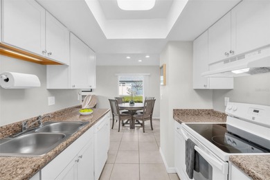 Beautifully renovated and spacious villa in Palm Harbor's on Highland Lakes Executive Golf Course in Florida - for sale on GolfHomes.com, golf home, golf lot