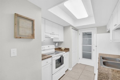 Beautifully renovated and spacious villa in Palm Harbor's on Highland Lakes Executive Golf Course in Florida - for sale on GolfHomes.com, golf home, golf lot