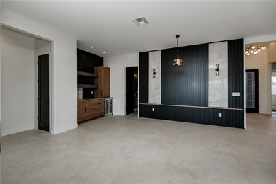 Experience modern luxury and energy-efficient living in this on Los Lagos Golf Club in Arizona - for sale on GolfHomes.com, golf home, golf lot