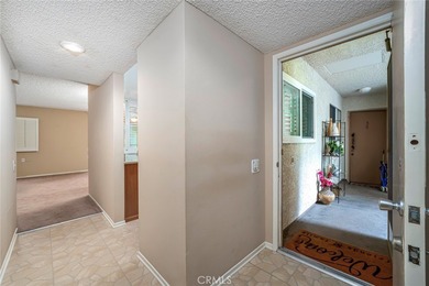 Welcome to this bright and inviting Villa Nueva model nestled in on Leisure Village Par 3 Golf Course in California - for sale on GolfHomes.com, golf home, golf lot