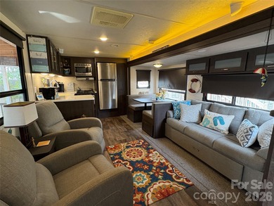 Ideal lake getaway in a true lake-life community. Beautifully on Old North State Club at Uwharrie Point Golf community in North Carolina - for sale on GolfHomes.com, golf home, golf lot