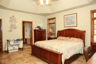 Welcome to 10812 Bay Ridge Drive -- a beautiful two-story home on Lions Den Golf Club in Arkansas - for sale on GolfHomes.com, golf home, golf lot