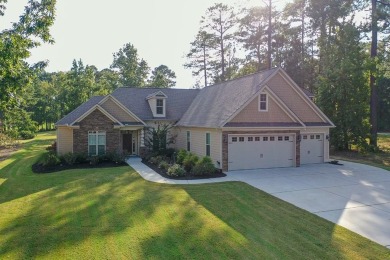This beautiful home in the gated Grand Harbor community offers a on The Patriot Golf Club At Grand Harbor in South Carolina - for sale on GolfHomes.com, golf home, golf lot