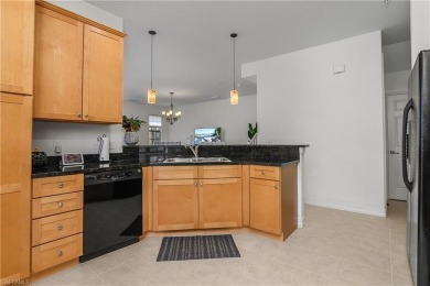 Lovely Santa Rosa townhouse features three bedrooms and a den on Lely Resort Golf and Country Club in Florida - for sale on GolfHomes.com, golf home, golf lot
