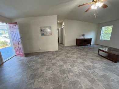 This 1560 square foot home has a unique very spacious floor on Whisperwood Golf Course in Florida - for sale on GolfHomes.com, golf home, golf lot