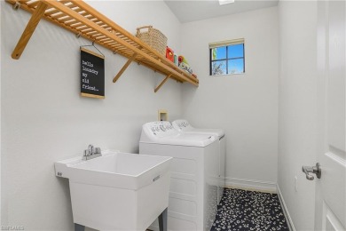 Lovely Santa Rosa townhouse features three bedrooms and a den on Lely Resort Golf and Country Club in Florida - for sale on GolfHomes.com, golf home, golf lot