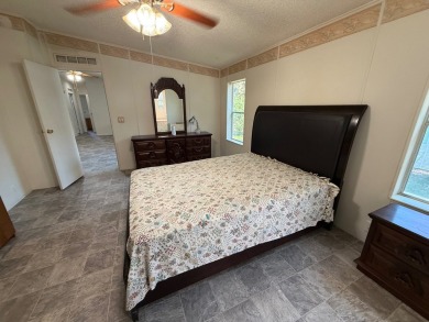 This 1560 square foot home has a unique very spacious floor on Whisperwood Golf Course in Florida - for sale on GolfHomes.com, golf home, golf lot