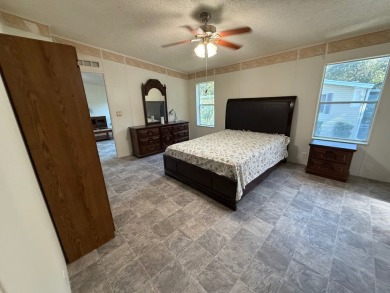 This 1560 square foot home has a unique very spacious floor on Whisperwood Golf Course in Florida - for sale on GolfHomes.com, golf home, golf lot