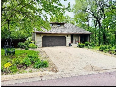 Tucked away on a wooded double-parcel lot, this exceptional on Redwood Falls Golf Club in Minnesota - for sale on GolfHomes.com, golf home, golf lot