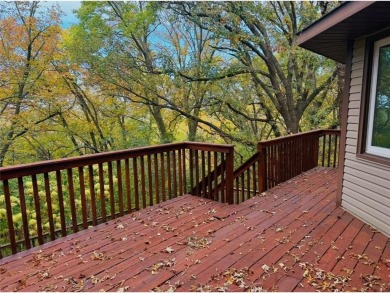 Tucked away on a wooded double-parcel lot, this exceptional on Redwood Falls Golf Club in Minnesota - for sale on GolfHomes.com, golf home, golf lot
