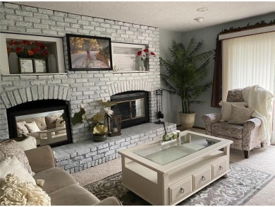 Tucked away on a wooded double-parcel lot, this exceptional on Redwood Falls Golf Club in Minnesota - for sale on GolfHomes.com, golf home, golf lot