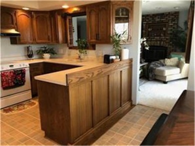 Tucked away on a wooded double-parcel lot, this exceptional on Redwood Falls Golf Club in Minnesota - for sale on GolfHomes.com, golf home, golf lot