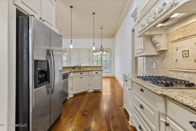 Great curb appeal on this four bedroom three bath home in Lake on Lake Caroline Golf Club in Mississippi - for sale on GolfHomes.com, golf home, golf lot