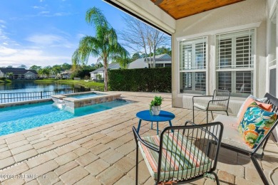 Beautifully renovated POOL w/ SPA home overlooking a serene lake on St. Johns Golf and Country Club in Florida - for sale on GolfHomes.com, golf home, golf lot