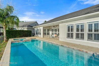 Beautifully renovated POOL w/ SPA home overlooking a serene lake on St. Johns Golf and Country Club in Florida - for sale on GolfHomes.com, golf home, golf lot