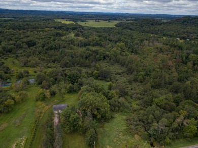 This perfectly located home sits on 15 acres close to Castle on Castle Rock Golf and Country Club in Wisconsin - for sale on GolfHomes.com, golf home, golf lot