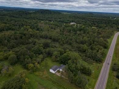 This perfectly located home sits on 15 acres close to Castle on Castle Rock Golf and Country Club in Wisconsin - for sale on GolfHomes.com, golf home, golf lot