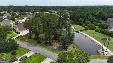 Premier Golf Course Lot with Pond Views    Discover one of the on Oak Grove Island Golf and Country Club in Georgia - for sale on GolfHomes.com, golf home, golf lot