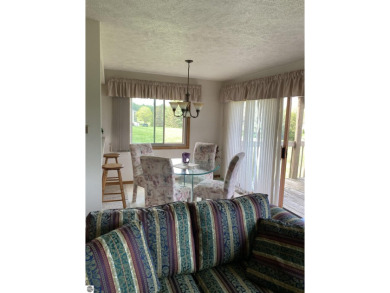 This is a great deal for a 4 bedroom, 3 bath condo just minutes on Crown Golf Course in Michigan - for sale on GolfHomes.com, golf home, golf lot