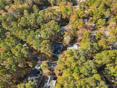 Located in a 24-hour guarded/gated community, this meticulously on Carolina Trace Country Club in North Carolina - for sale on GolfHomes.com, golf home, golf lot