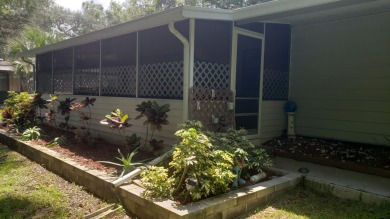 Large lovingly maintained fully furnished 2 bedroom 2 bath home on Tomoka Oaks Golf and Country Club in Florida - for sale on GolfHomes.com, golf home, golf lot