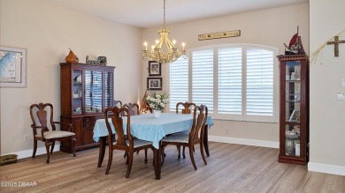 This stunning 4-bedroom saltwater pool home offers both elegance on Plantation Bay Golf and Country Club in Florida - for sale on GolfHomes.com, golf home, golf lot