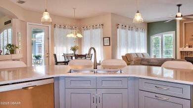 This stunning 4-bedroom saltwater pool home offers both elegance on Plantation Bay Golf and Country Club in Florida - for sale on GolfHomes.com, golf home, golf lot