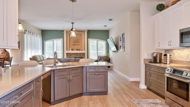 This stunning 4-bedroom saltwater pool home offers both elegance on Plantation Bay Golf and Country Club in Florida - for sale on GolfHomes.com, golf home, golf lot