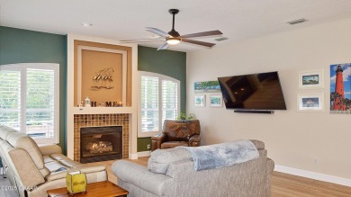 This stunning 4-bedroom saltwater pool home offers both elegance on Plantation Bay Golf and Country Club in Florida - for sale on GolfHomes.com, golf home, golf lot