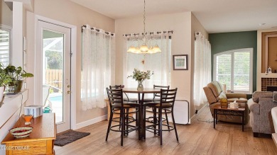 This stunning 4-bedroom saltwater pool home offers both elegance on Plantation Bay Golf and Country Club in Florida - for sale on GolfHomes.com, golf home, golf lot