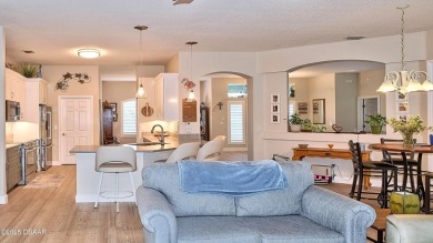 This stunning 4-bedroom saltwater pool home offers both elegance on Plantation Bay Golf and Country Club in Florida - for sale on GolfHomes.com, golf home, golf lot