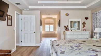 This stunning 4-bedroom saltwater pool home offers both elegance on Plantation Bay Golf and Country Club in Florida - for sale on GolfHomes.com, golf home, golf lot