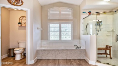 This stunning 4-bedroom saltwater pool home offers both elegance on Plantation Bay Golf and Country Club in Florida - for sale on GolfHomes.com, golf home, golf lot