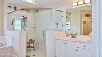 This stunning 4-bedroom saltwater pool home offers both elegance on Plantation Bay Golf and Country Club in Florida - for sale on GolfHomes.com, golf home, golf lot