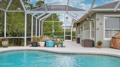 This stunning 4-bedroom saltwater pool home offers both elegance on Plantation Bay Golf and Country Club in Florida - for sale on GolfHomes.com, golf home, golf lot