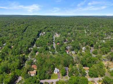Step into this bright and beautifully styled 3-bedroom, 2-bath on Pocono Farms Country Club in Pennsylvania - for sale on GolfHomes.com, golf home, golf lot