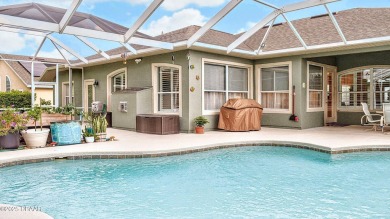 This stunning 4-bedroom saltwater pool home offers both elegance on Plantation Bay Golf and Country Club in Florida - for sale on GolfHomes.com, golf home, golf lot