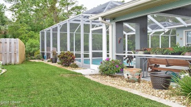 This stunning 4-bedroom saltwater pool home offers both elegance on Plantation Bay Golf and Country Club in Florida - for sale on GolfHomes.com, golf home, golf lot