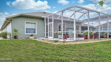 This stunning 4-bedroom saltwater pool home offers both elegance on Plantation Bay Golf and Country Club in Florida - for sale on GolfHomes.com, golf home, golf lot