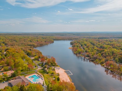 Step into this bright and beautifully styled 3-bedroom, 2-bath on Pocono Farms Country Club in Pennsylvania - for sale on GolfHomes.com, golf home, golf lot