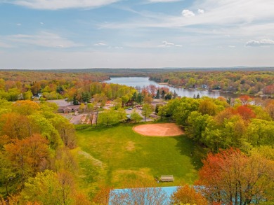 Step into this bright and beautifully styled 3-bedroom, 2-bath on Pocono Farms Country Club in Pennsylvania - for sale on GolfHomes.com, golf home, golf lot